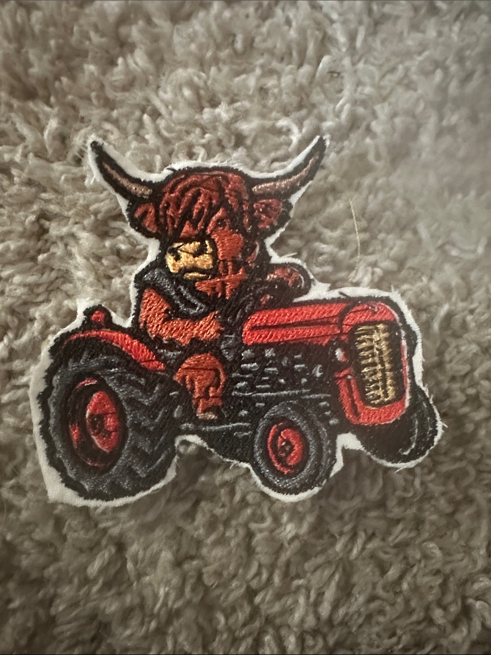 embroidered cow on tractor iron on patch
